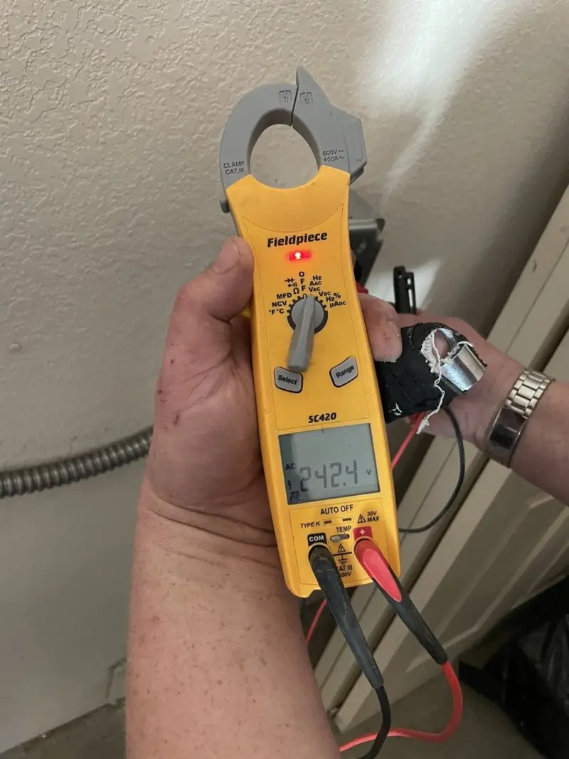 Voltage testing with clamp meter during Hot Tub / Pool Electrical Wiring in Forest